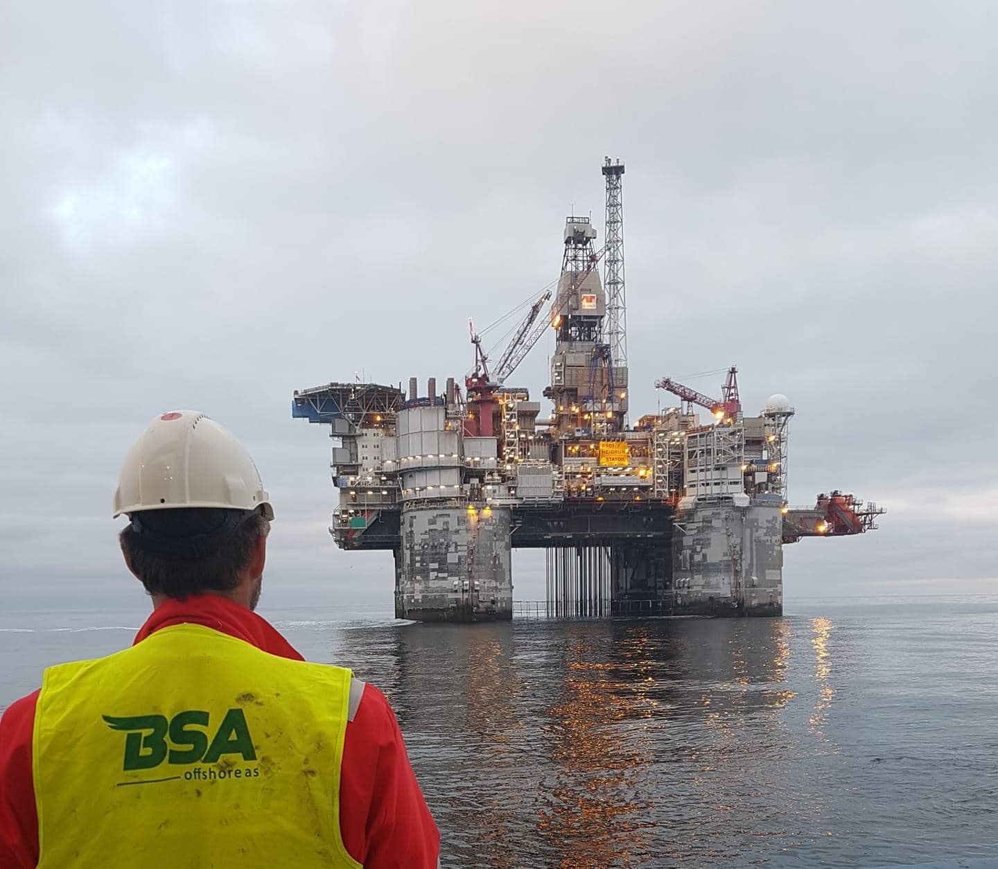 BSA Offshore worker looking at oil rig